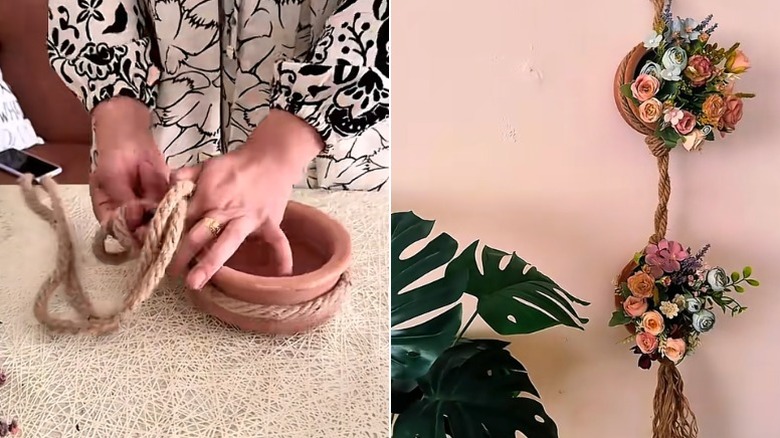 İçinde pastel sahte çiçekler bulunan, pişmiş toprak bir bitkiden yapılmış asılı bir saksı.